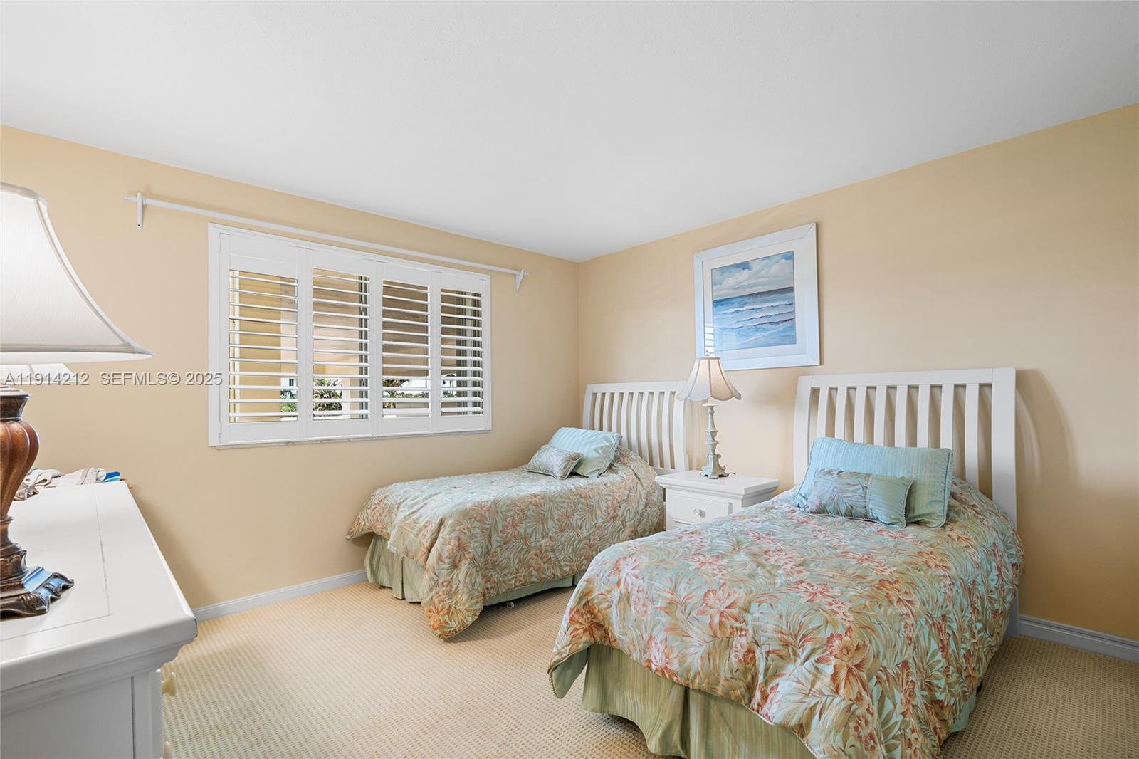 350 South Beach Road, Unit 204 Tequesta, FL 33469 - Photo 19 of 36 a bedroom with two beds and a window