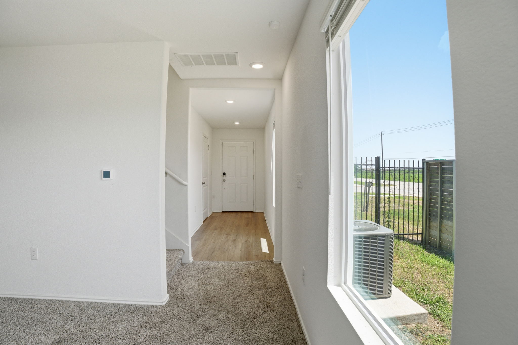12213 Rising Moon Lane Del Valle, TX 78617 - Photo 6 of 19 a view of entryway with wooden floor