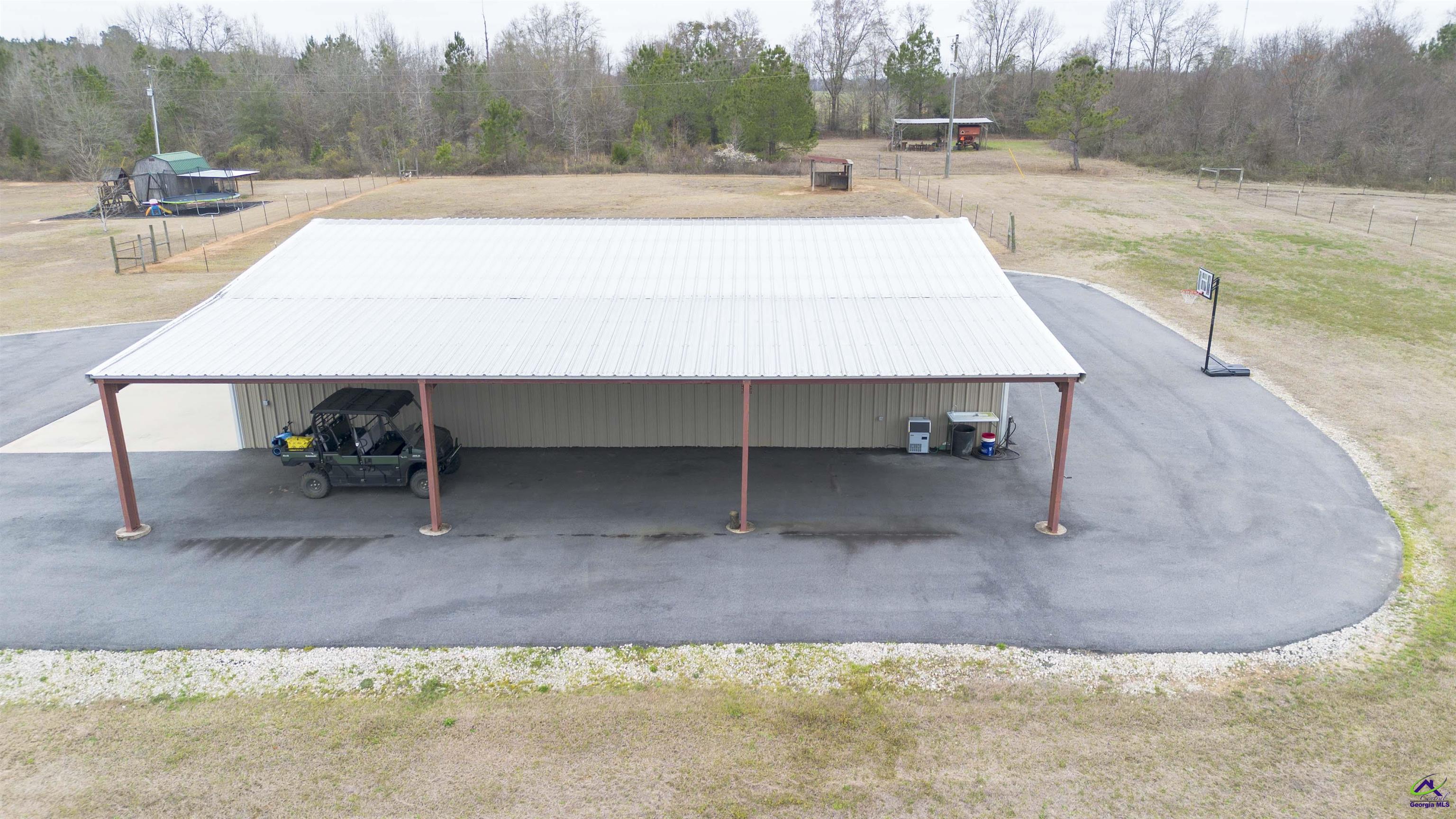 500 Old Milledgeville Road Cochran, GA 31014 - Photo 15 of 48 a view of a swimming pool with a yard