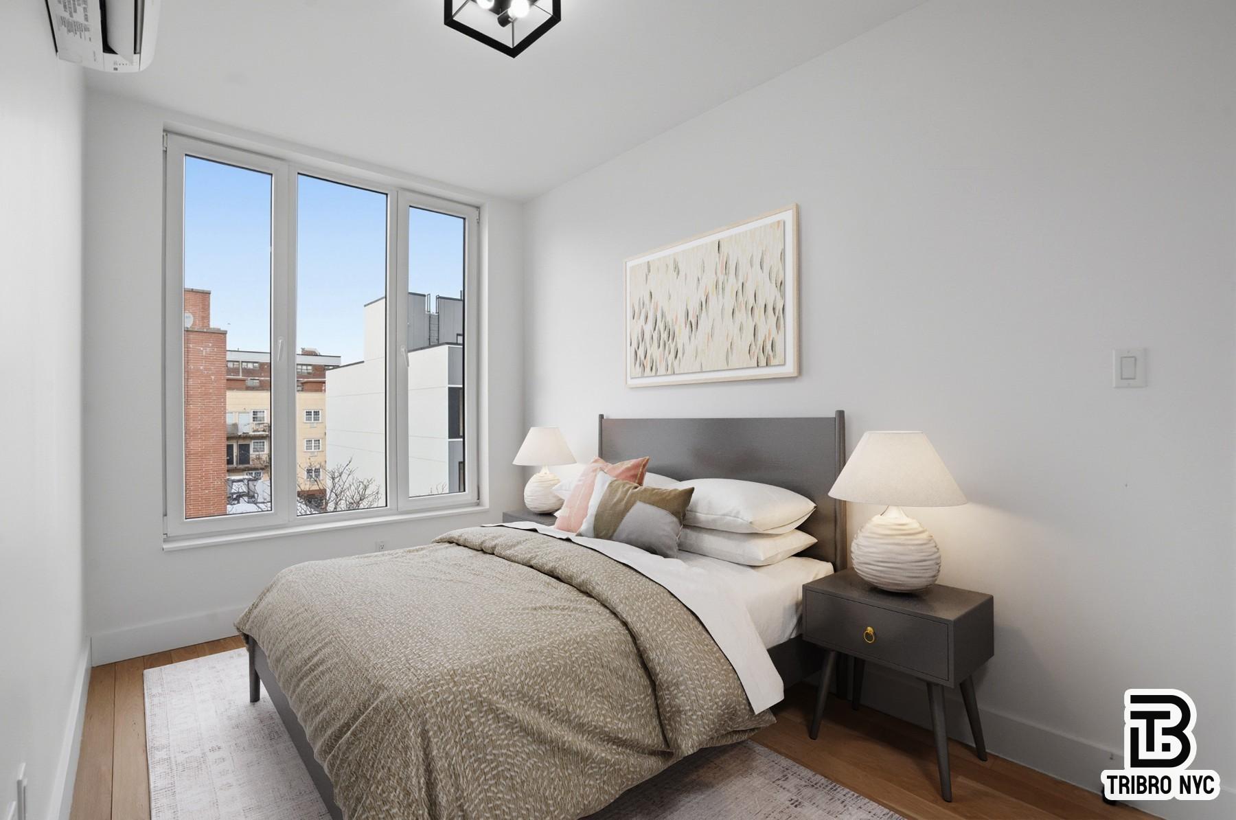 96 Moore Street, Unit 2R Brooklyn, NY 11206 - Photo 3 of 8 a bedroom with a bed and a window