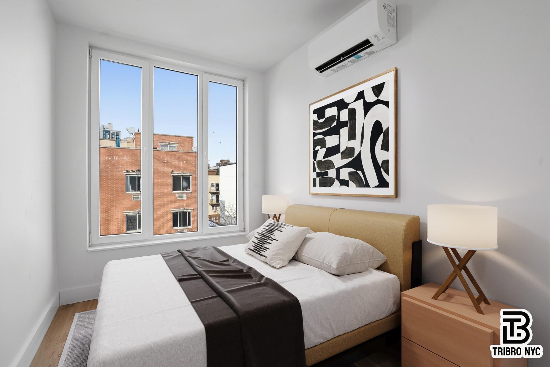 96 Moore Street, Unit 2R Brooklyn, NY 11206 - Photo 4 of 8 a bedroom with a bed and a painting on the wall