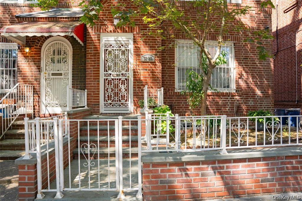 33-26 83rd Street Queens, NY 11372 - Photo 2 of 18 a view of a brick building with a door