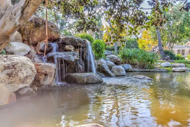 a view of a lake with furniture