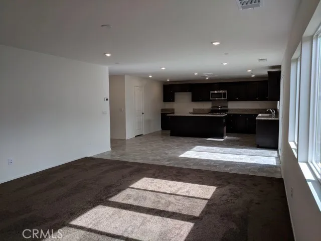 a kitchen with a sink and a stove top oven