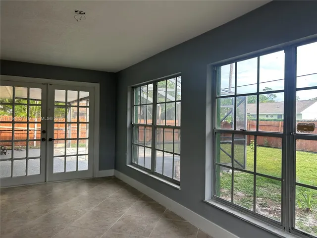 a view of an empty room with a large window