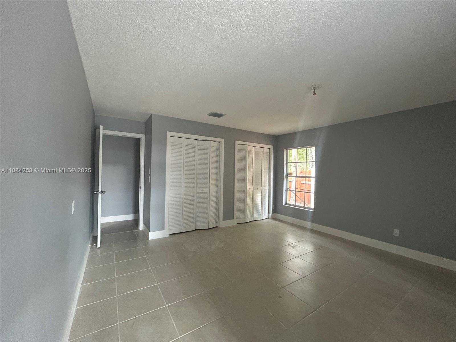 7109 Santa Rosa Parkway Fort Pierce, FL 34951 - Photo 7 of 11 a view of an empty room with a window