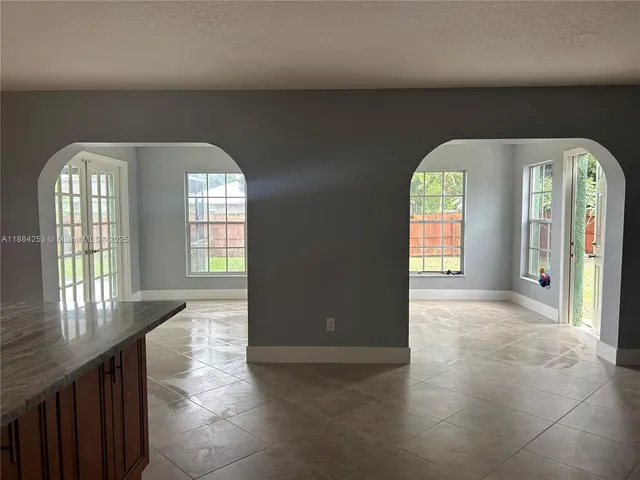 a view of entryway and hall with a window