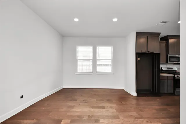 a view of a kitchen and a stove top oven