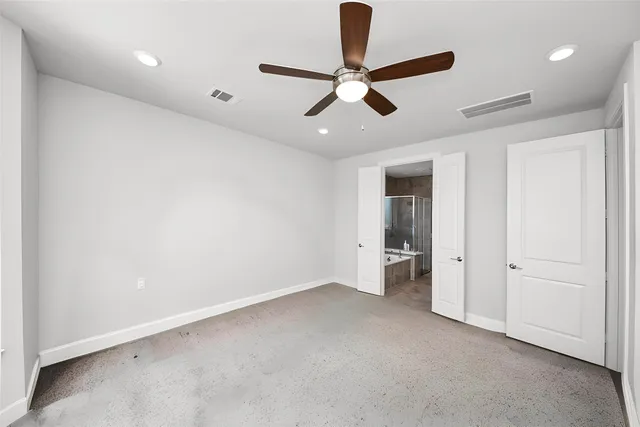 a spacious bathroom with a tub sink shower and mirror