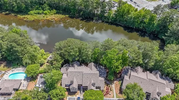 an aerial view of a house with a lake view