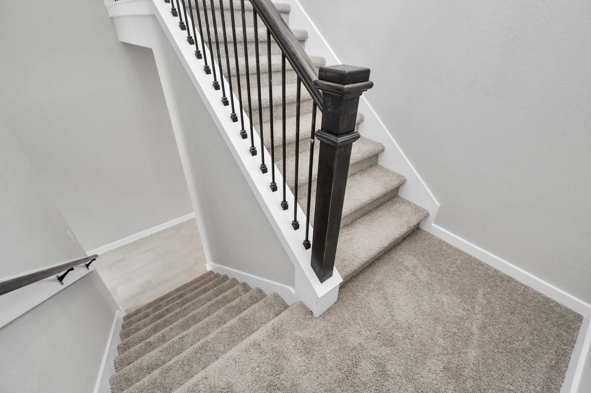 15111 Statice Trail Houston, TX 77044 - Photo 23 of 35 Premium carpet and metal balusters throughout. Sample photo of completed home with similar floor plan. Actual colors and selections may vary.