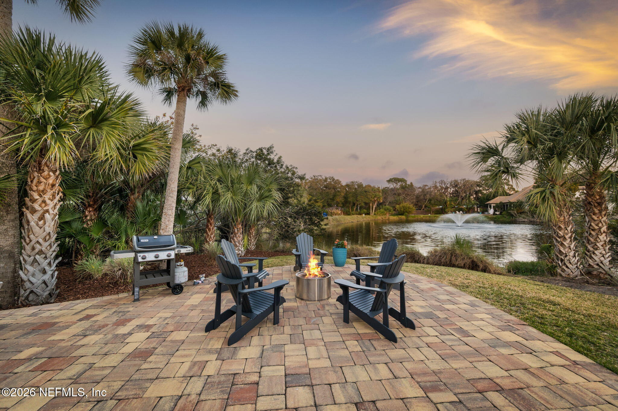 115 Spoonbill Point Court St. Augustine, FL 32080 - Photo 39 of 50 a swimming pool with outdoor seating and trees