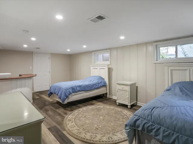 a bedroom with a bed and a dresser
