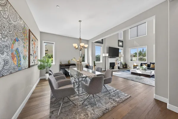 a living room with fireplace furniture and a flat screen tv