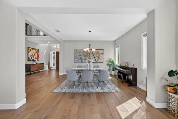 a living room with fireplace furniture and a wooden floor