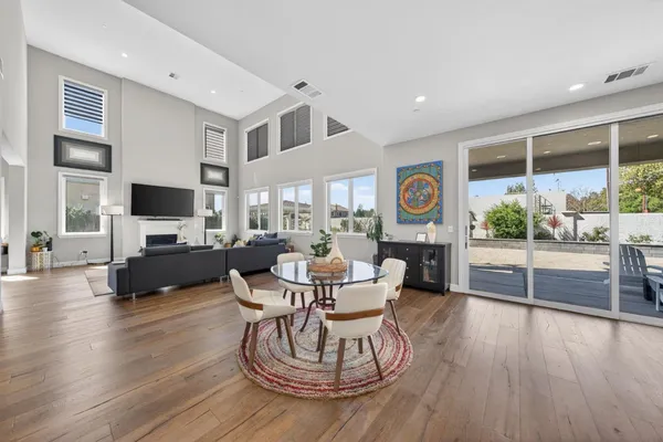 a large kitchen with stainless steel appliances kitchen island granite countertop a large island in the center