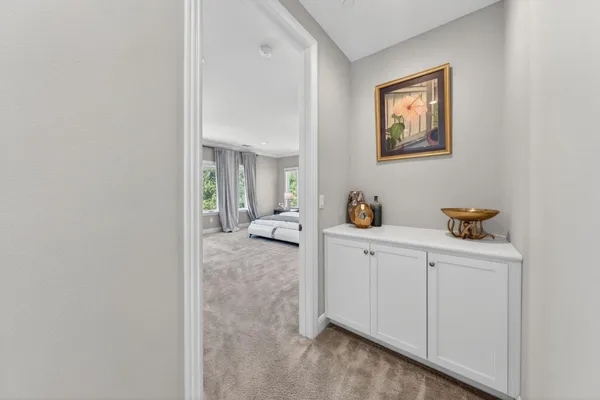 a spacious en suite bathroom with double vanity and a mirror