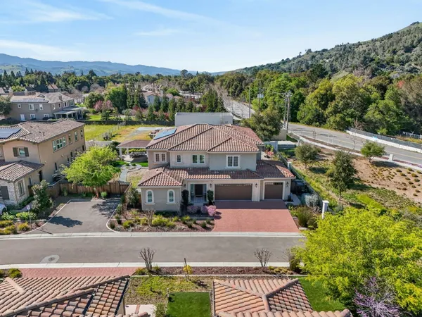 an aerial view of a house with a garden