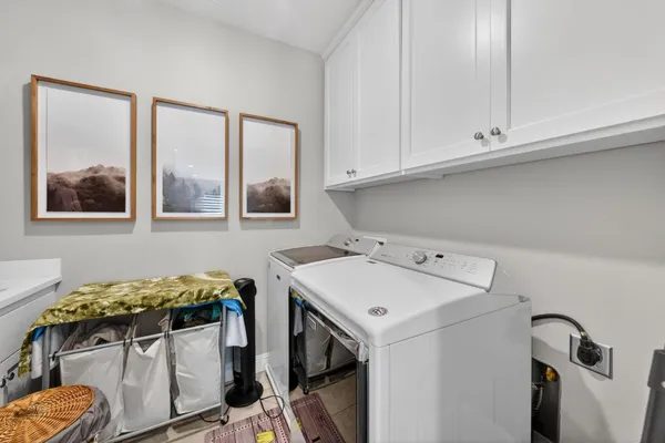 a front view of a house with garden and patio