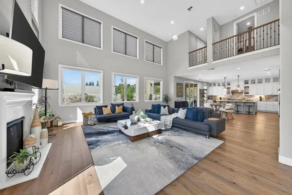 a living room with fireplace furniture and a flat screen tv