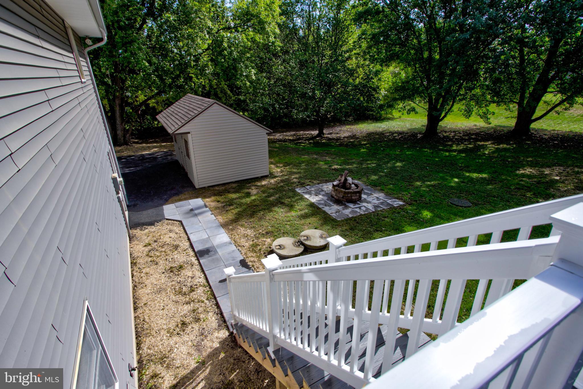 2891 Newport Road Manheim, PA 17545 - Photo 14 of 56 a view of a deck with a chair and table