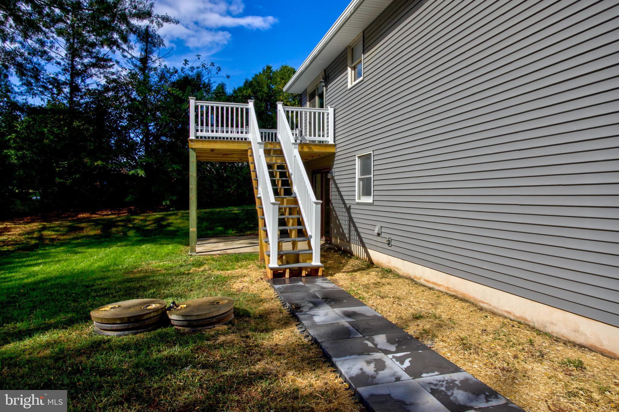 2891 Newport Road Manheim, PA 17545 - Photo 18 of 56 a view of a backyard with plants and a patio