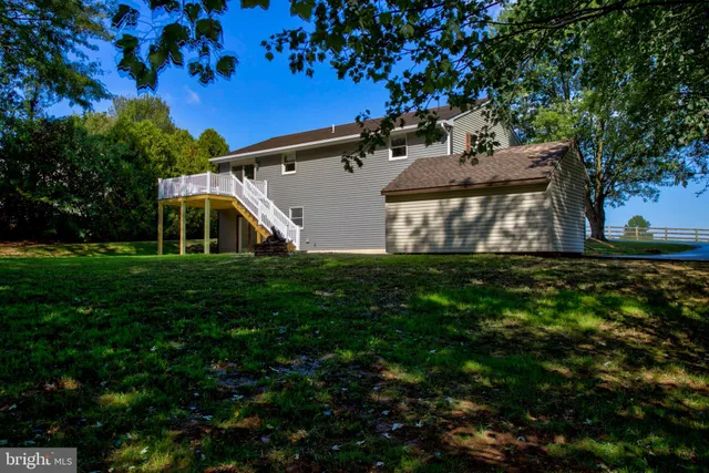 an empty room with wooden floor and closet