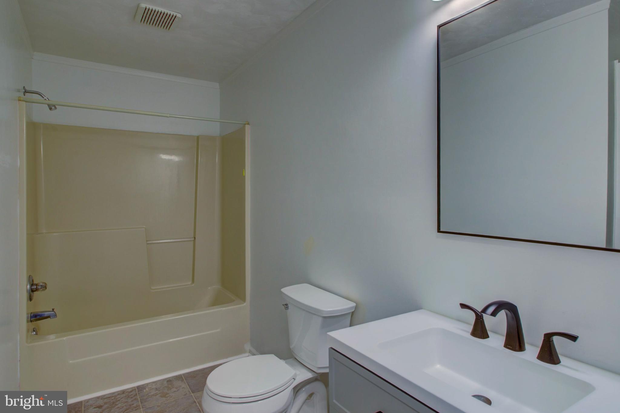 2891 Newport Road Manheim, PA 17545 - Photo 28 of 56 a bathroom with a sink toilet and shower