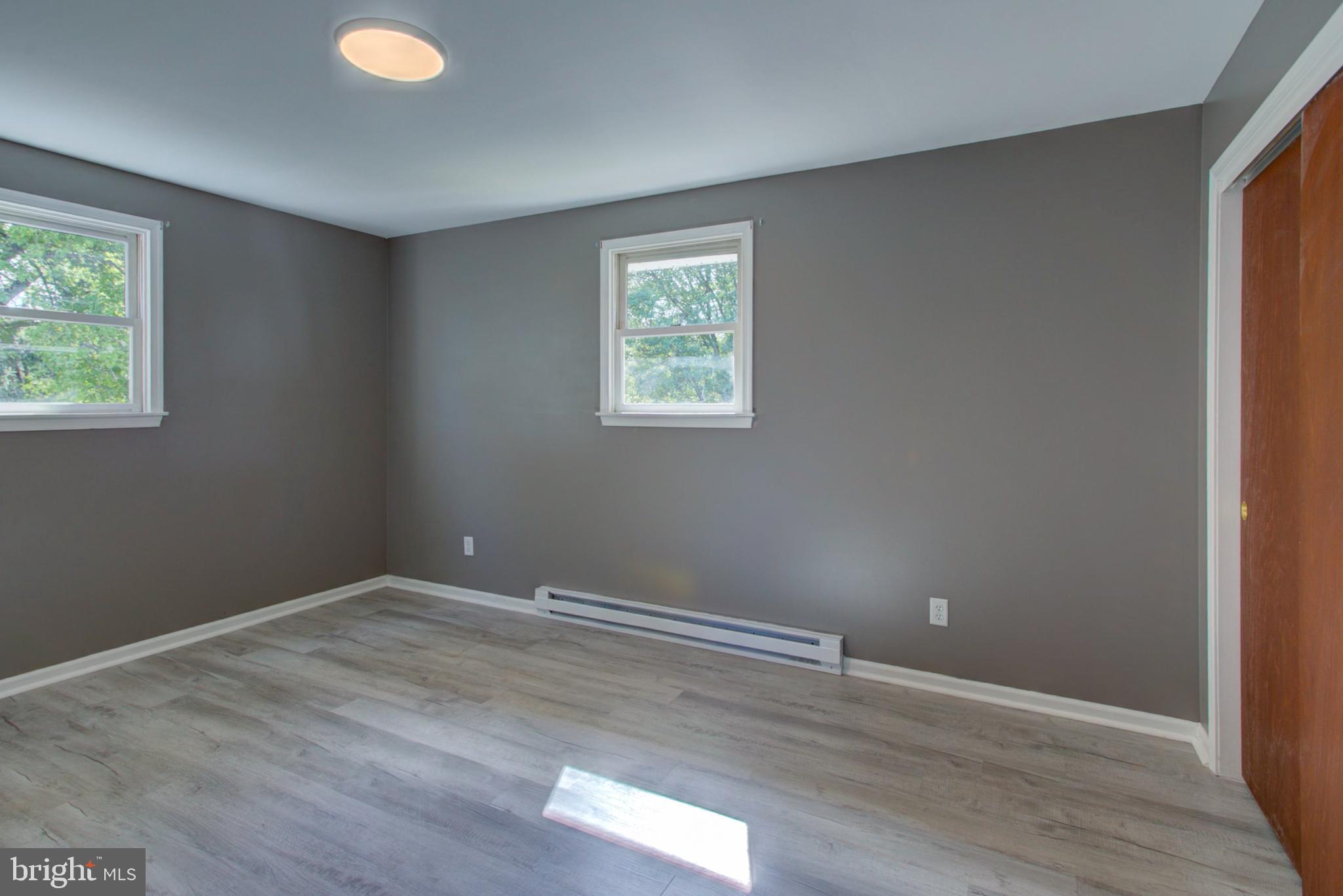 2891 Newport Road Manheim, PA 17545 - Photo 29 of 56 a view of an empty room with wooden floor and a window