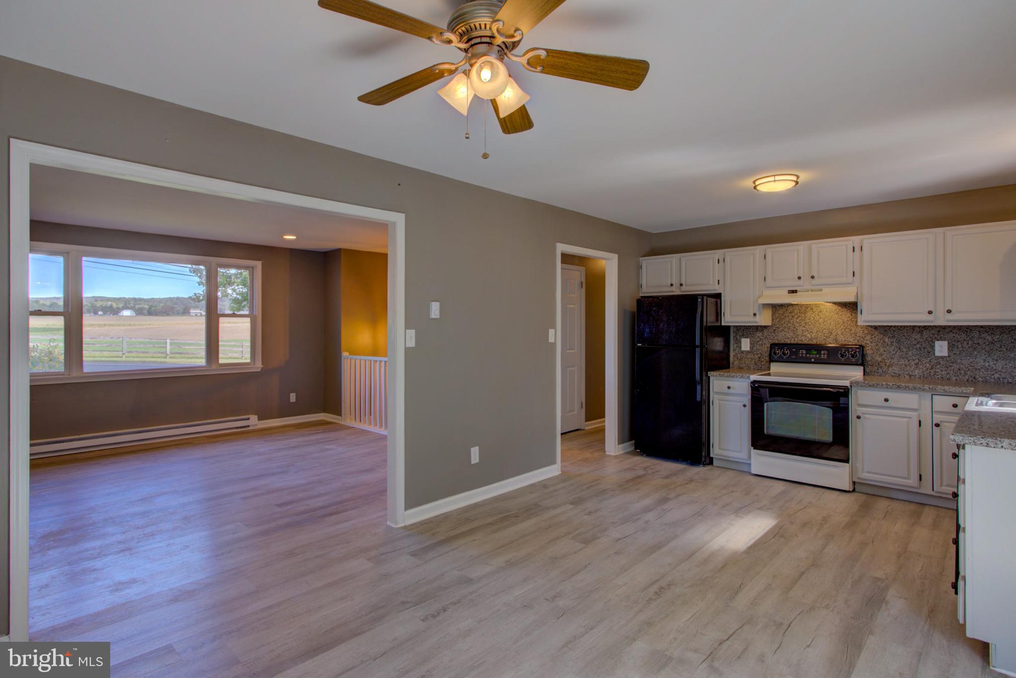 2891 Newport Road Manheim, PA 17545 - Photo 3 of 56 a kitchen with stainless steel appliances granite countertop a refrigerator and a stove top oven