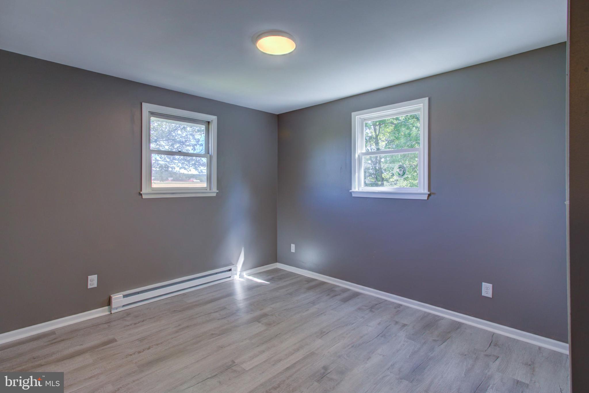 2891 Newport Road Manheim, PA 17545 - Photo 31 of 56 a view of an empty room with wooden floor and a window