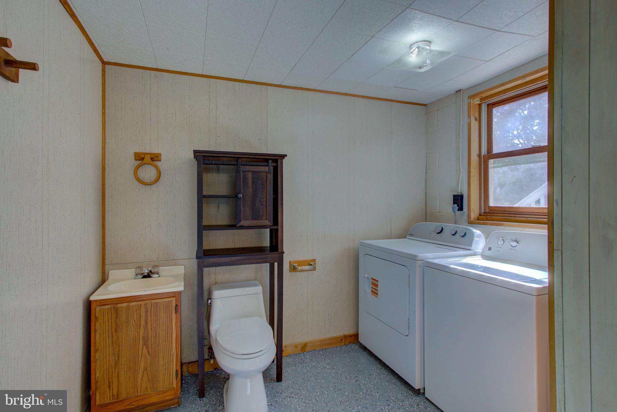 2891 Newport Road Manheim, PA 17545 - Photo 32 of 56 a bathroom with a granite countertop toilet sink and mirror