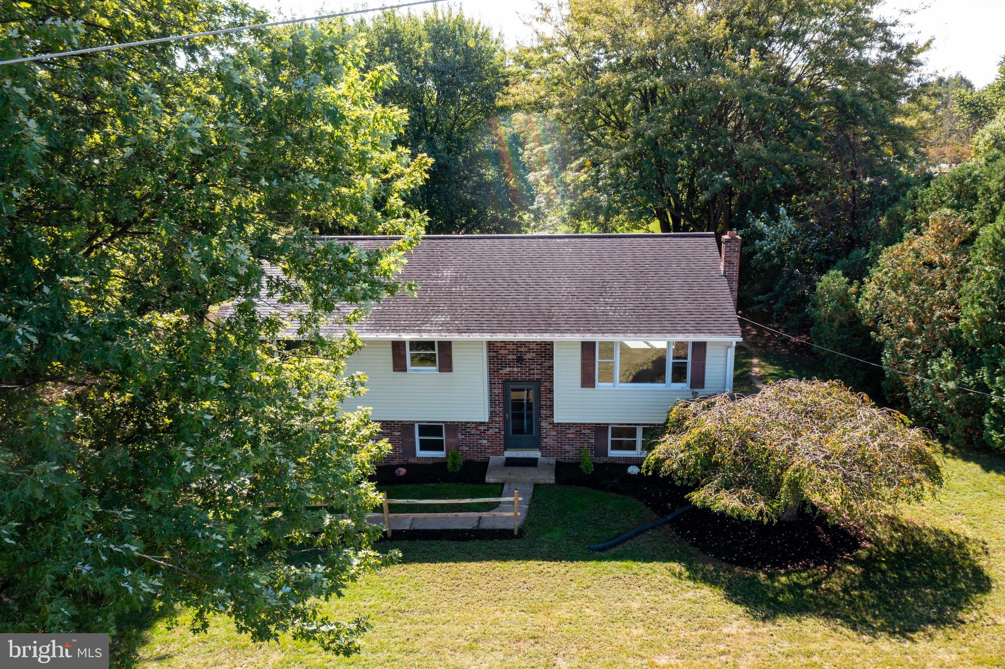 2891 Newport Road Manheim, PA 17545 - Photo 44 of 56 a view of a house with a yard plants and large tree