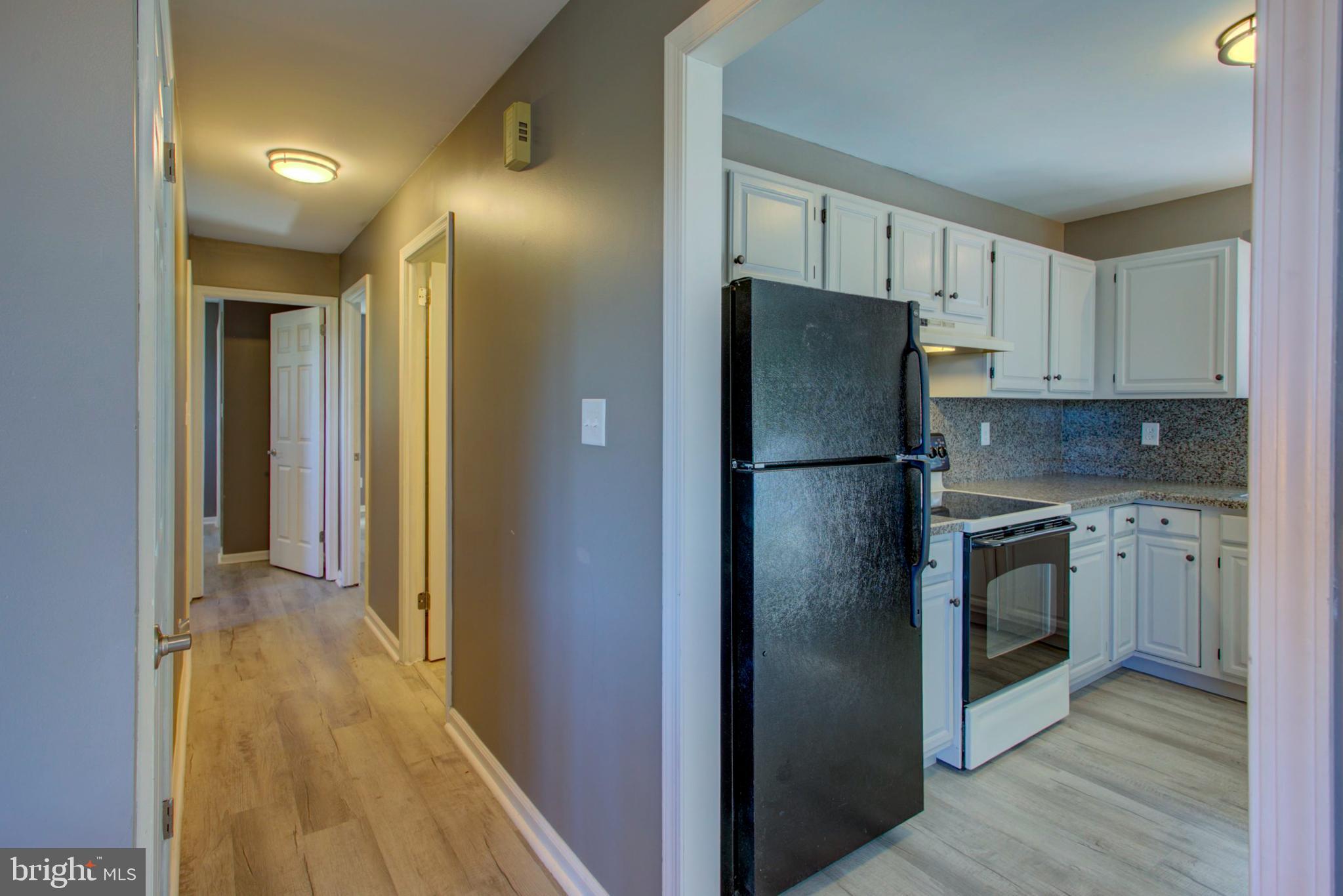 2891 Newport Road Manheim, PA 17545 - Photo 8 of 56 a kitchen with stainless steel appliances granite countertop a refrigerator and a stove top oven