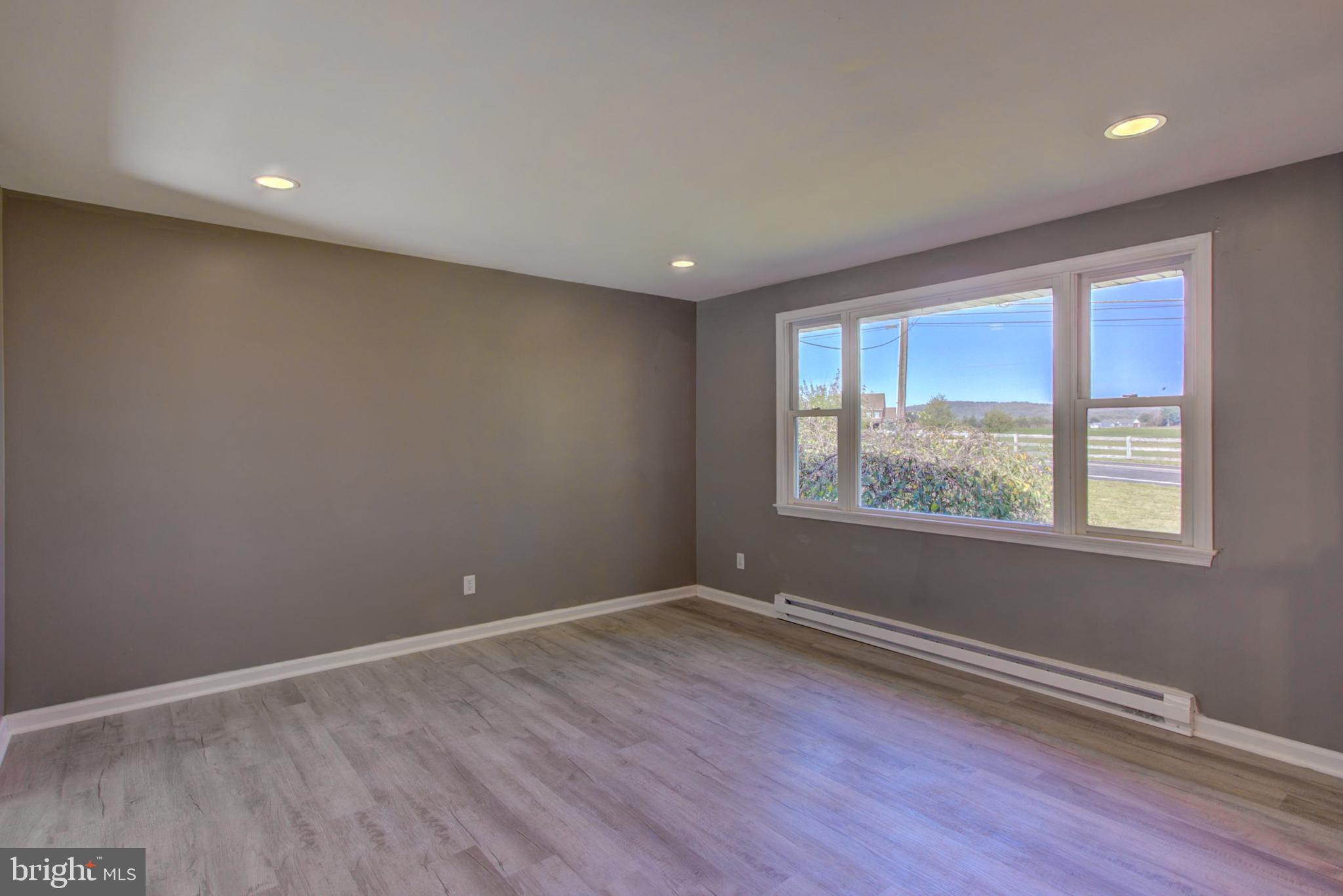 2891 Newport Road Manheim, PA 17545 - Photo 9 of 56 wooden floor in an empty room with a window