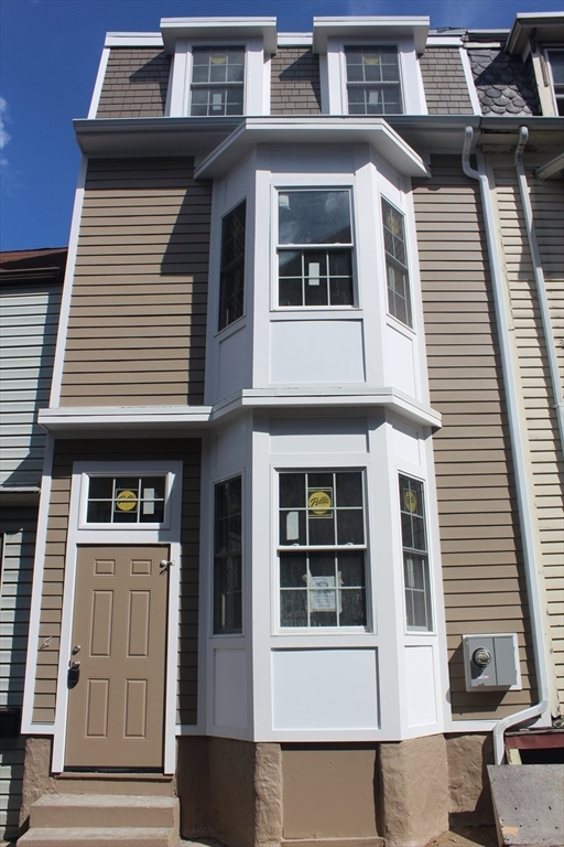 264 Bowen Street, Unit 264 Boston, MA 02127 - Photo 1 of 18 a front view of a house with a balcony