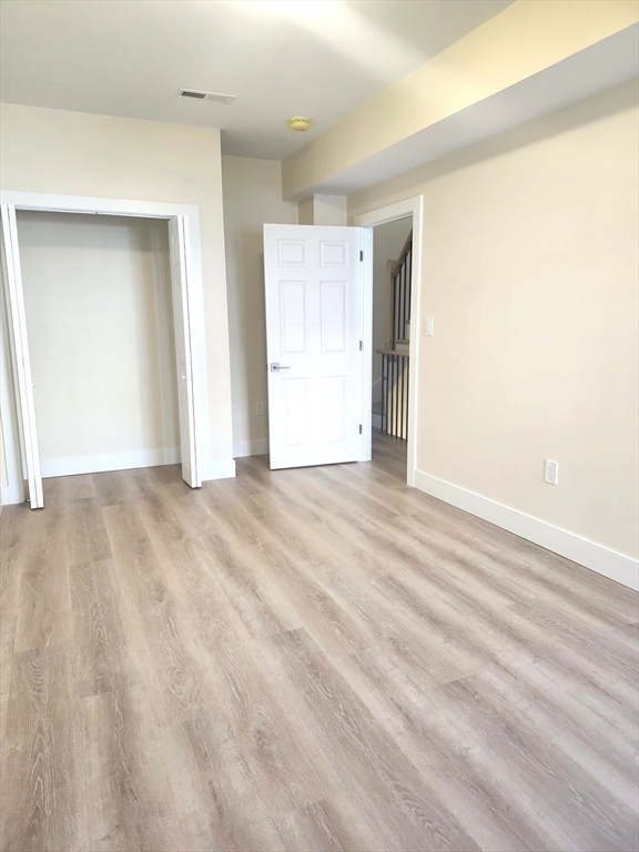 264 Bowen Street, Unit 264 Boston, MA 02127 - Photo 17 of 18 a view of an empty room and window
