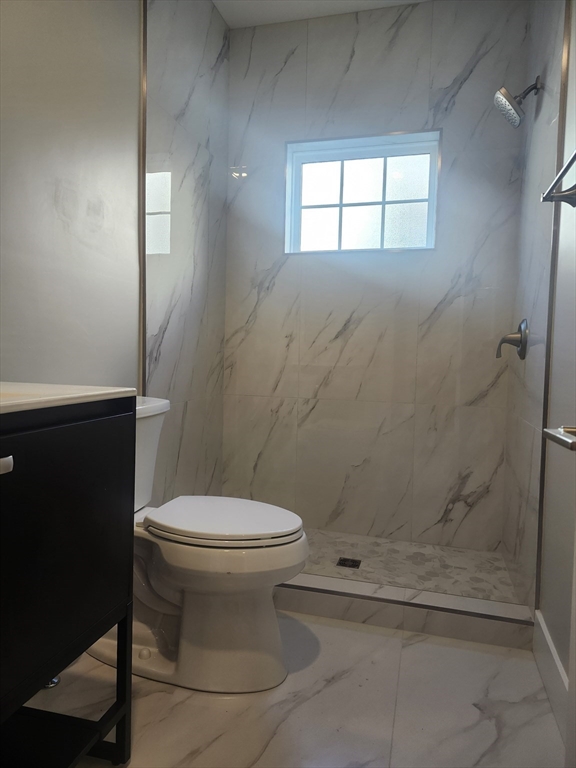264 Bowen Street, Unit 264 Boston, MA 02127 - Photo 6 of 18 a bathroom with a toilet and a shower