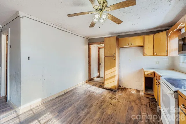 a view of kitchen with wooden floor and window