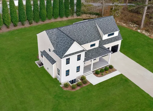 a aerial view of a house with a yard