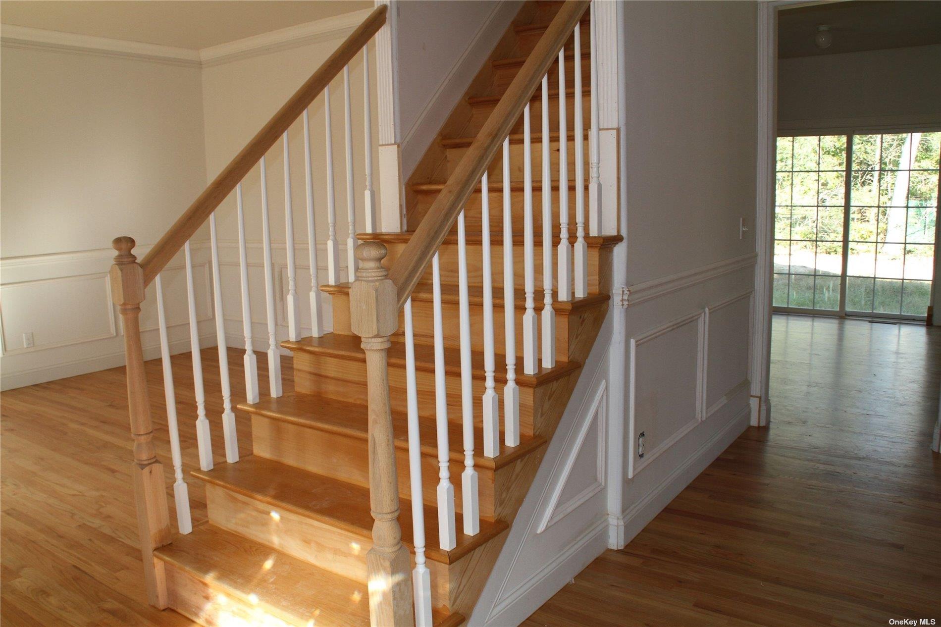 Lot 3 Eastport Manor Road Manorville, NY 11949 - Photo 4 of 6 a view of staircase with wooden floor and white walls