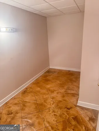 a utility room with sink dryer and washer
