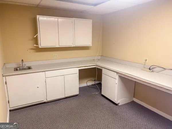 a view of a room with wooden walls