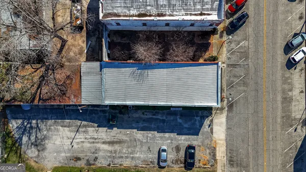 a view of a house with a snow on the road