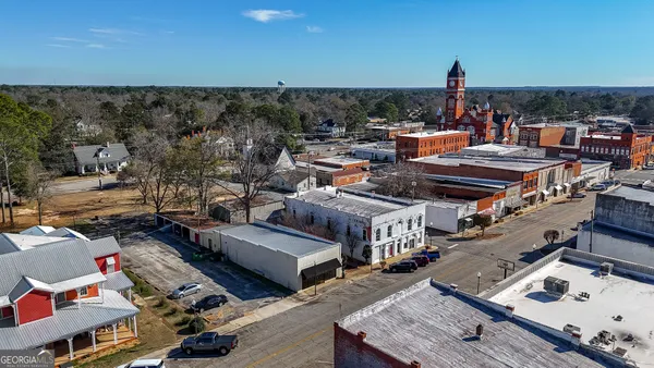 an aerial view of a building with outdoor space