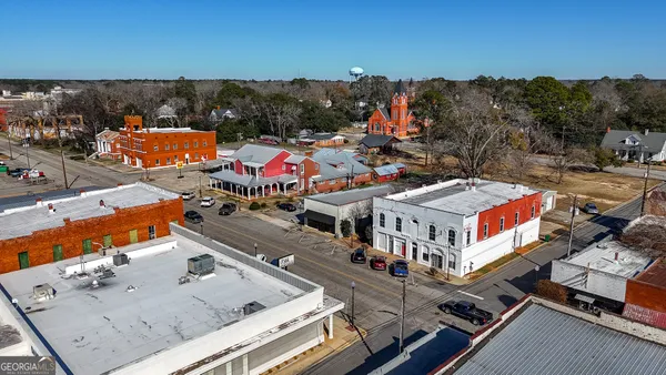 a terrace with outdoor seating and city view