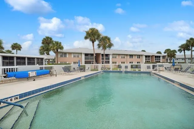 a view of swimming pool with outdoor seating