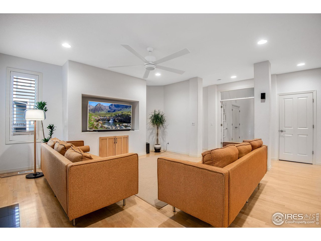 4026 Nevis Street Boulder, CO 80301 - Photo 18 of 40 a living room with furniture and a flat screen tv