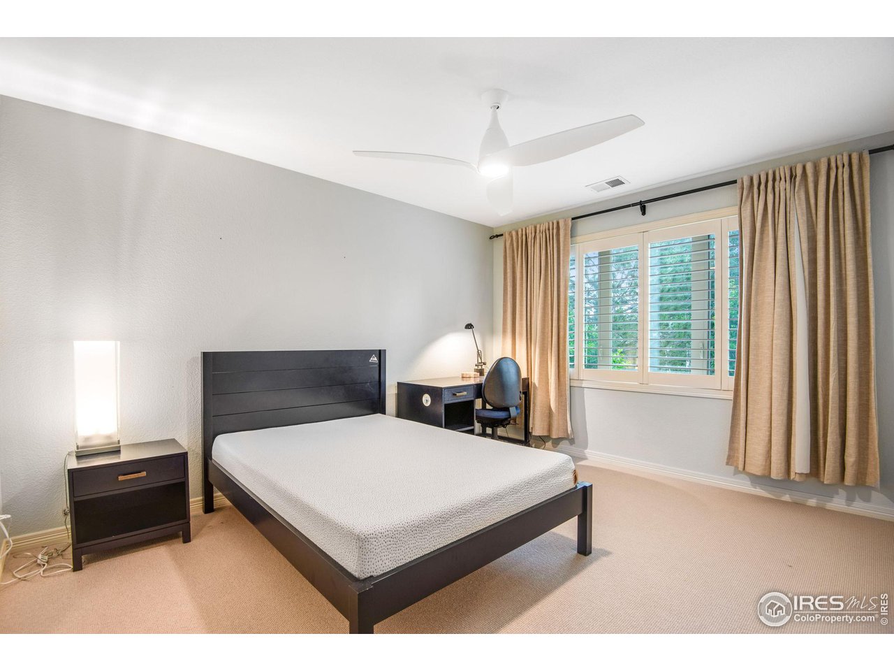 4026 Nevis Street Boulder, CO 80301 - Photo 26 of 40 a bedroom with a bed and window