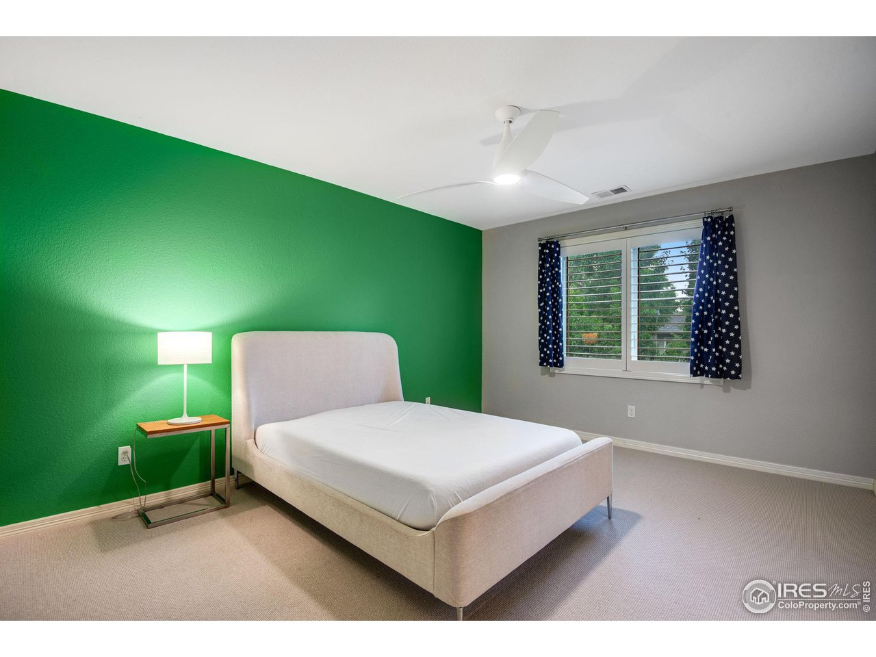 4026 Nevis Street Boulder, CO 80301 - Photo 28 of 40 a bed sitting in a spacious bedroom next to a window